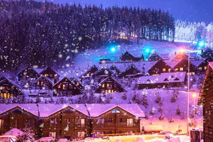 Finland, A fairy-tale house in the woods amid the snow-covered fir trees