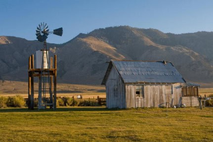 Weathered old shed and windmill on an eastern California cattle ranch.